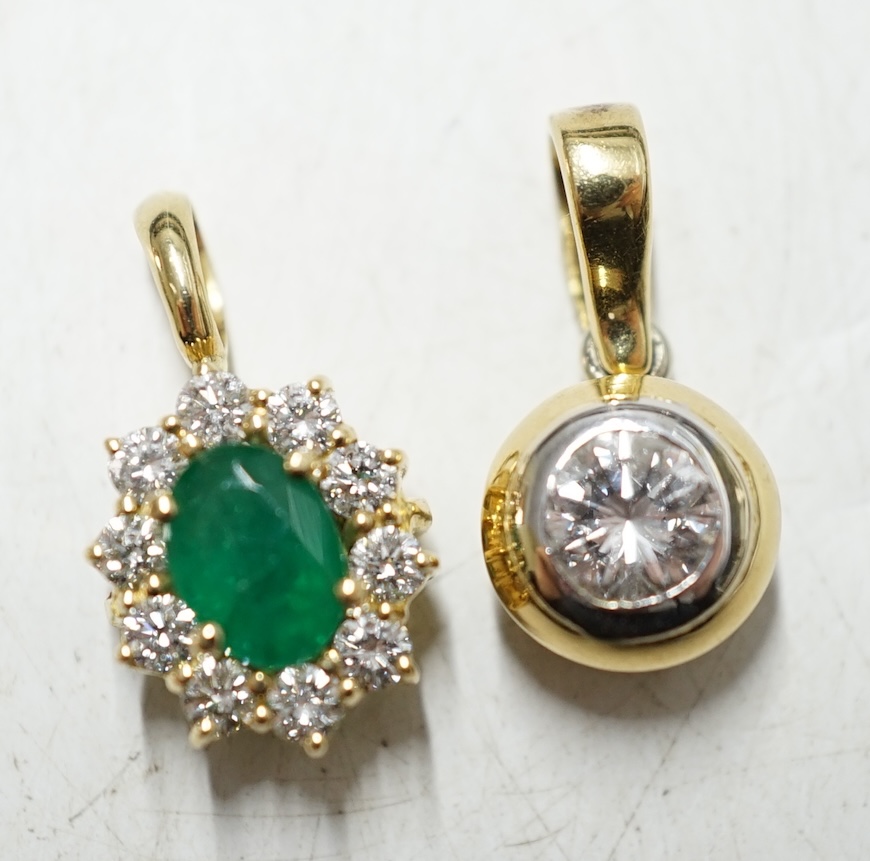 A modern 18ct gold and solitaire diamond set pendant and a similar unmarked yellow metal, emerald and diamond set oval pendant, gross weight 4,5 grams. Condition - fair to good